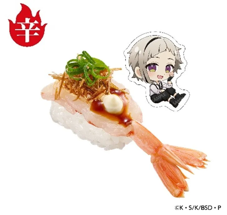 辛味マークとアニメキャラクターのチャームが添えられたエビ寿司。