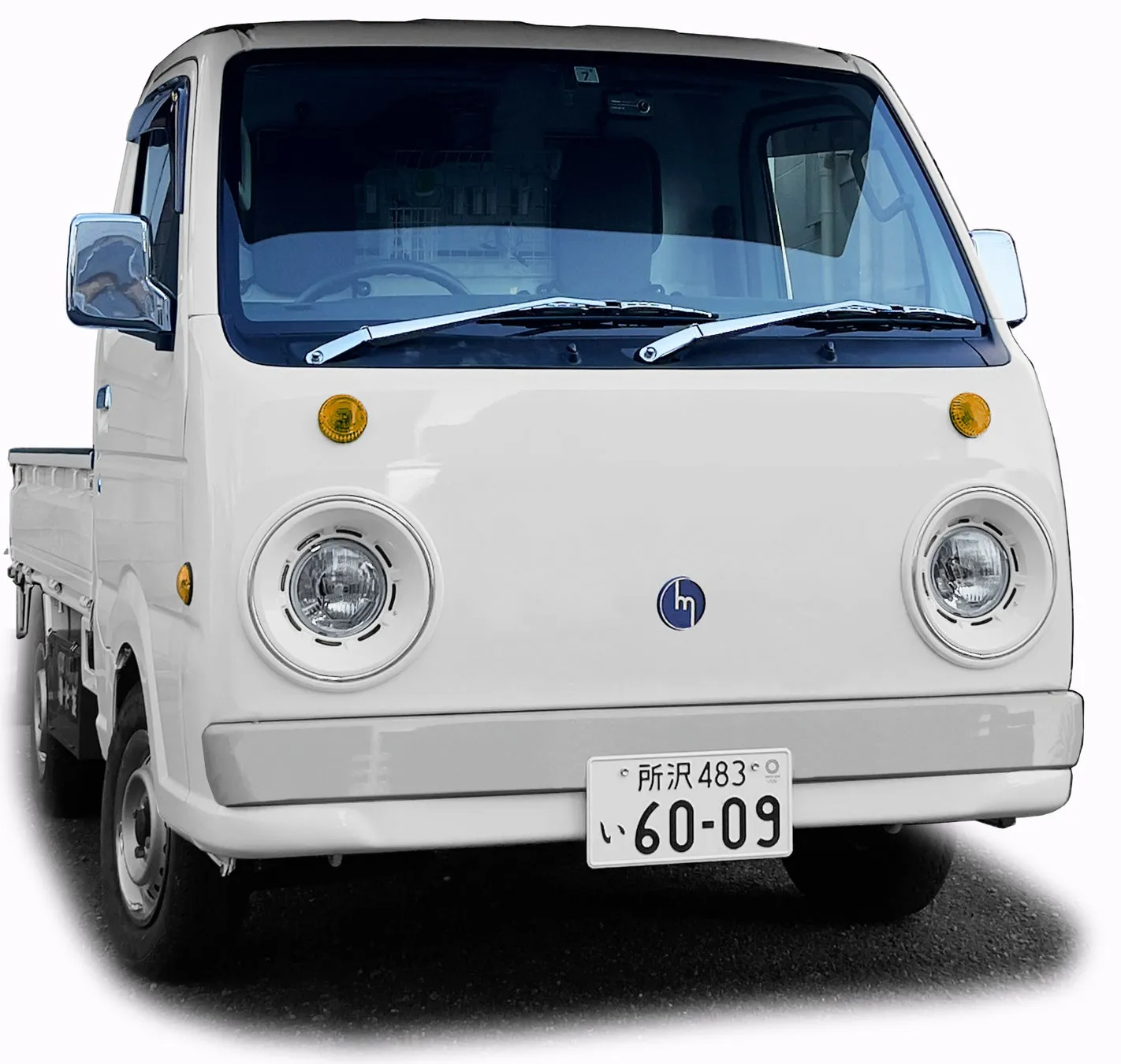白い軽トラックの正面画像、ナンバープレート「所沢 483 い 60-09」
