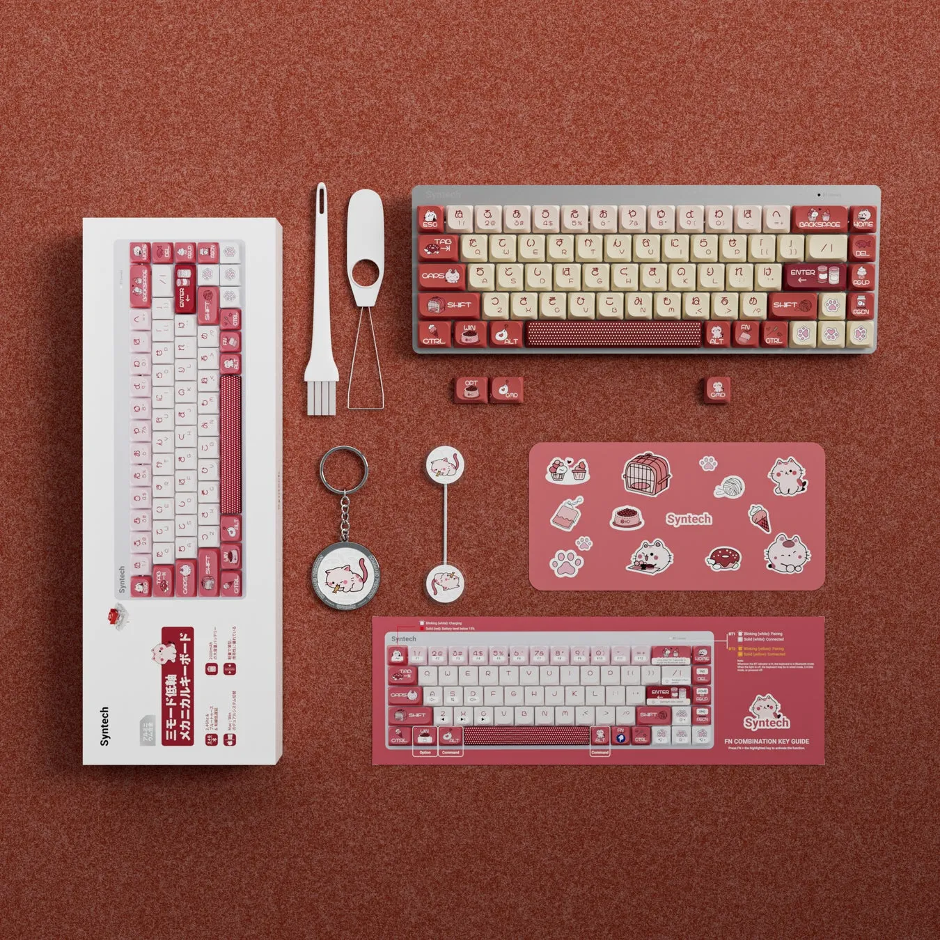 ピンク色のメカニカルキーボード、キーキャップ、キーボードアクセサリー、ステッカー、キーホルダーなどの製品を俯瞰で捉えた画像。