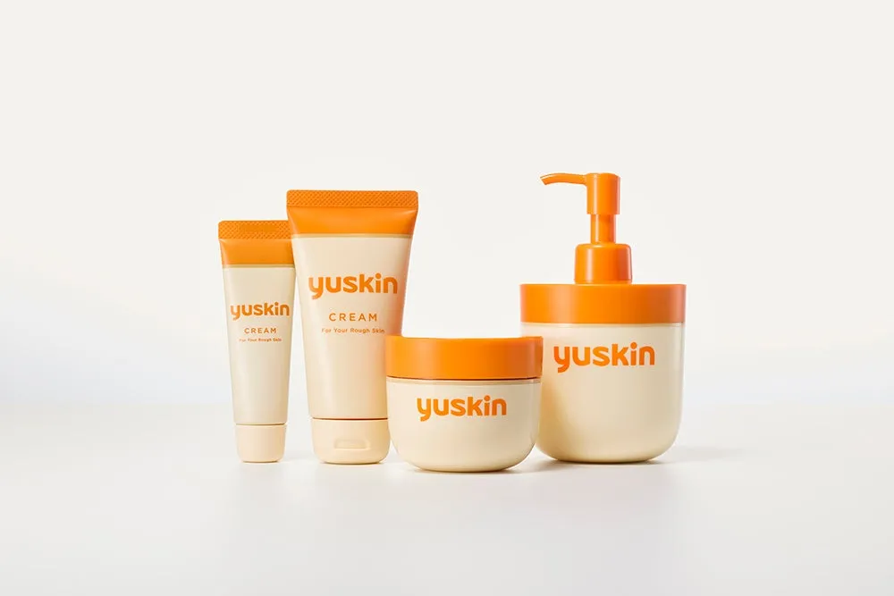 ユースキンクリームの製品群の写真です。チューブ、ジャー、ポンプボトルなど、様々な容器に入ったクリームが写っています。