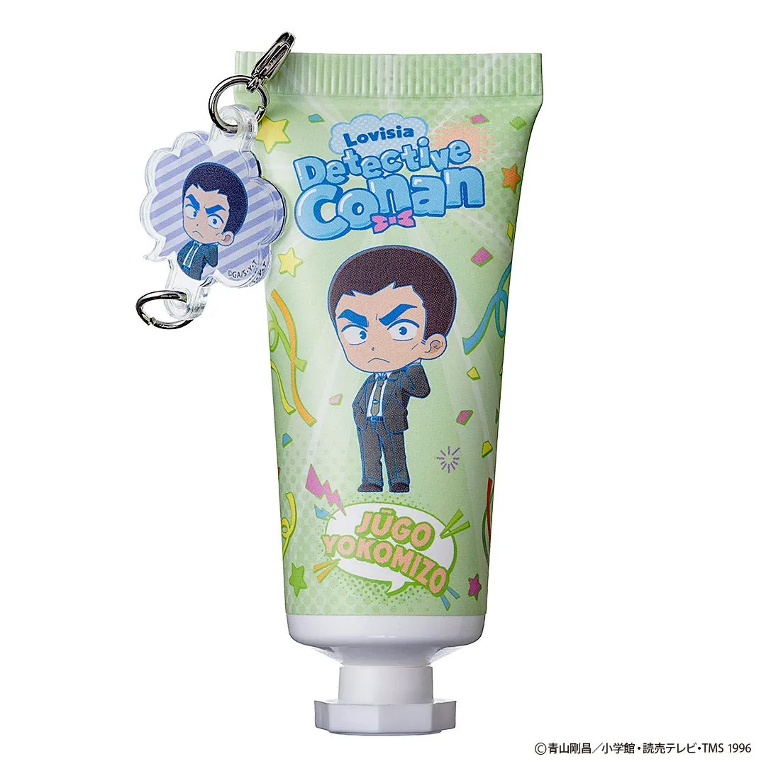 名探偵コナンのキャラクターが描かれた、緑色の歯磨き粉チューブとキーホルダーのセットです。歯磨き粉チューブには、横溝重悟のイラストが描かれています。キーホルダーにも横溝重悟のイラストが描かれています。
