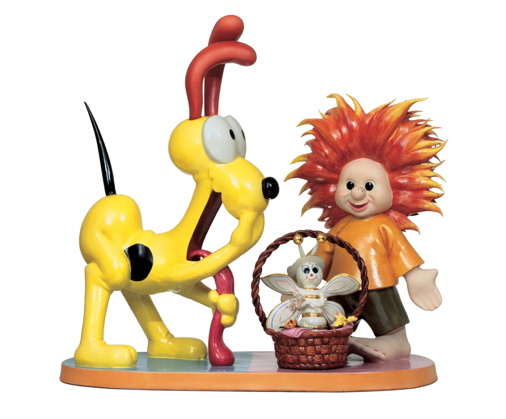 鮮やかな色の犬と、髪の毛が炎のような男の子と、バスケットに入った妖精の置物。