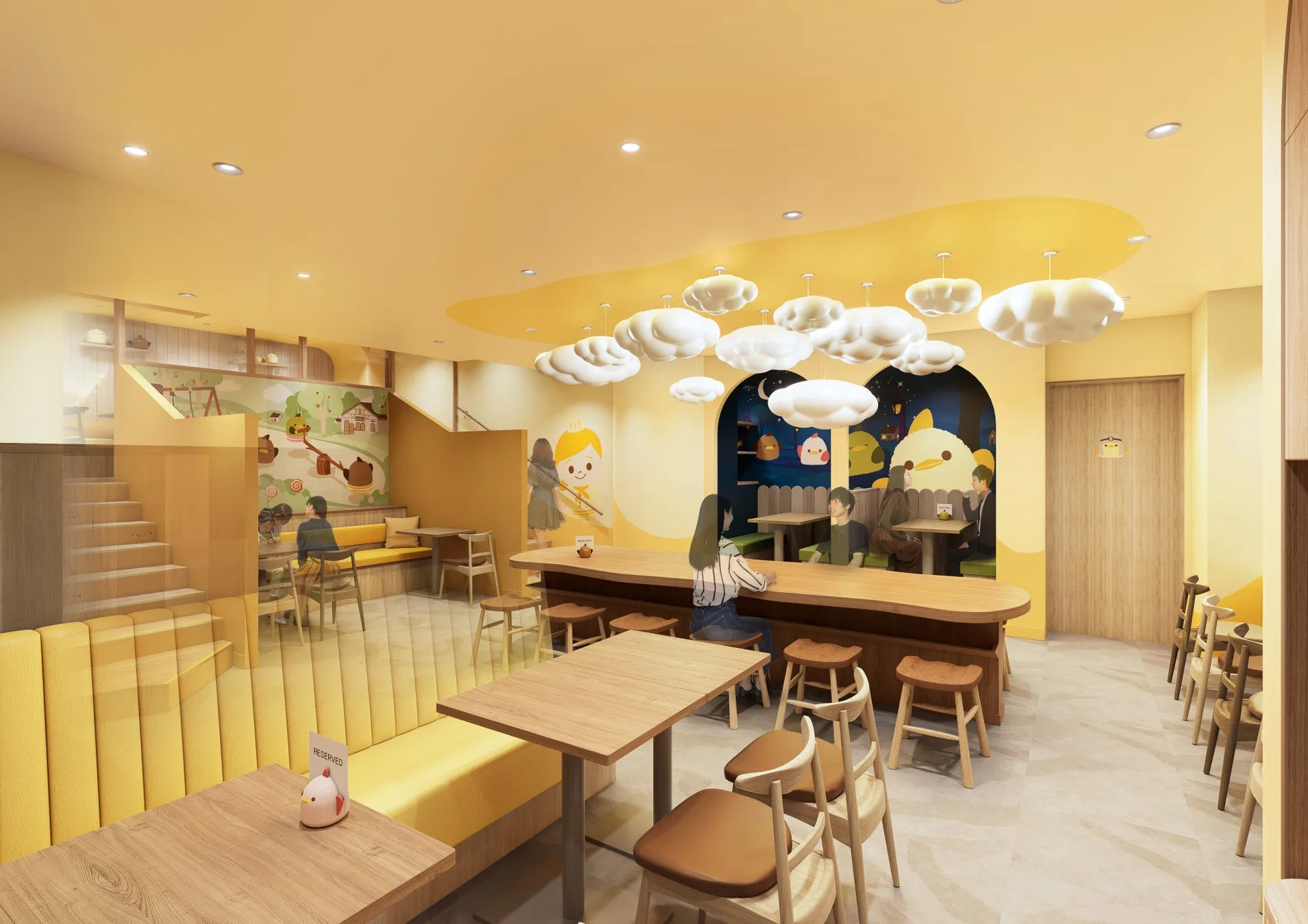 明るい黄色を基調とした、可愛らしい内装のカフェ。雲を模した照明や、壁のイラストが特徴的。テーブル席やカウンター席があり、様々な客層に対応できる。