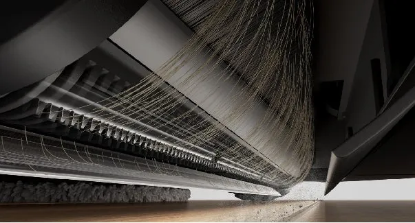 掃除機の内部構造のイラスト。回転するブラシと吸引口が見え、ゴミが吸い込まれる様子が描かれています。