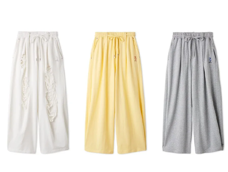3色のワイドパンツの画像です。白はダメージ加工、黄色とグレーはシンプルなデザインです。