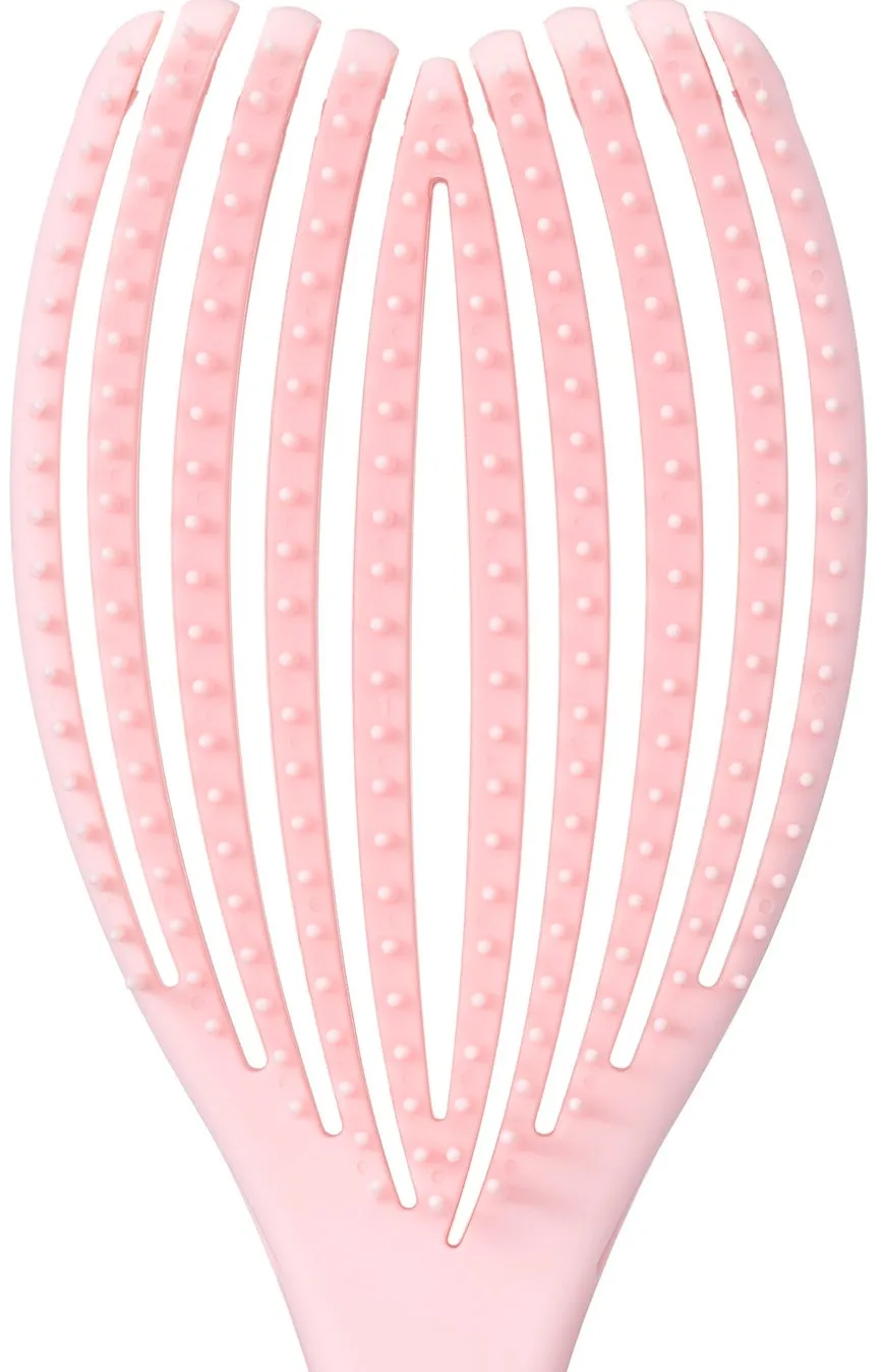 ピンク色のヘアブラシのクローズアップ写真