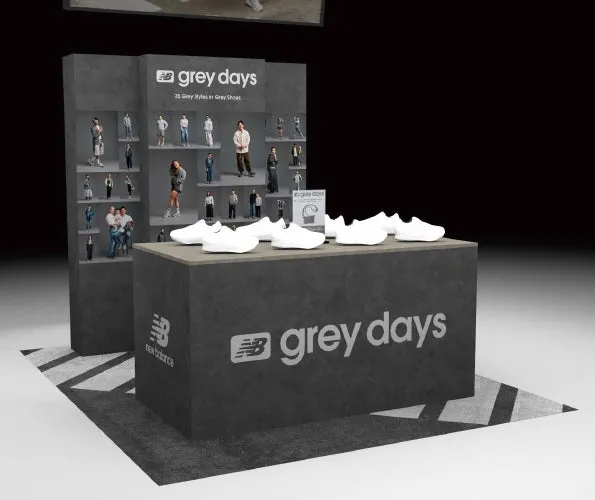 ニューバランスの「grey days」のディスプレイ。グレーを基調とした展示台に、白いスニーカーと小さなフィギュアが飾られている。
