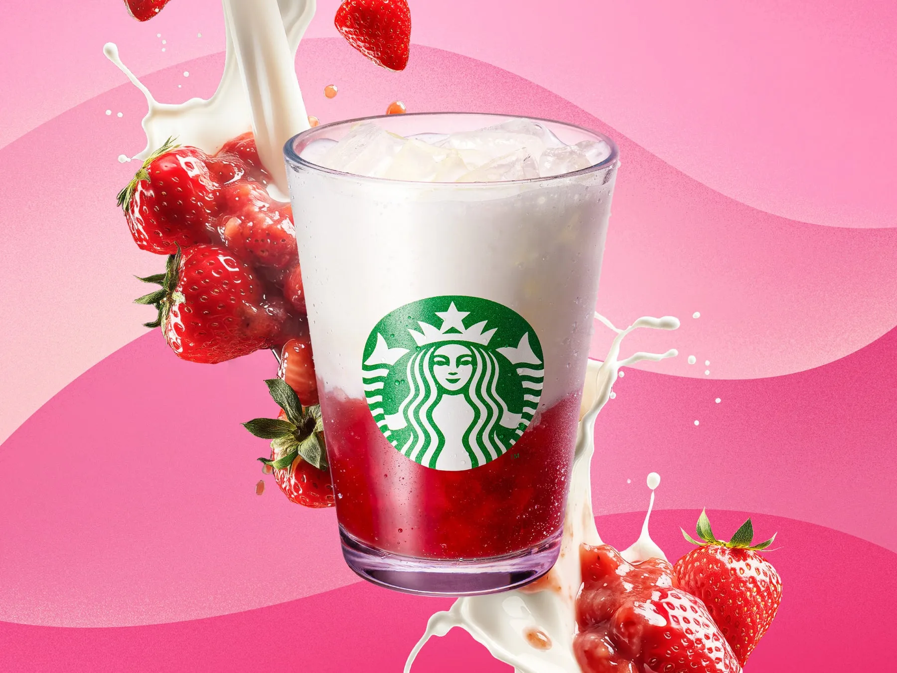 ストロベリー味のフラペチーノが、いちごやミルクの飛沫とともに描かれた写真