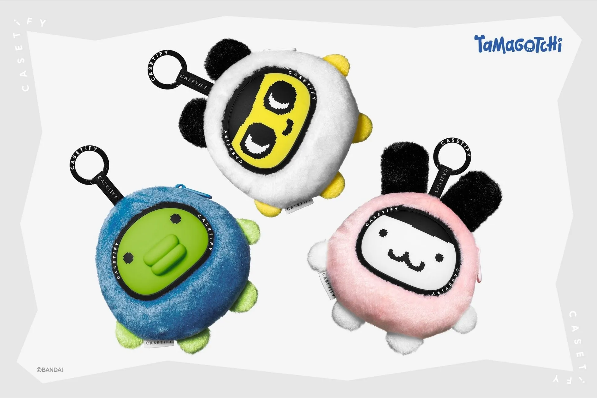 3つのTamagotchiのケース。白いケース、青いケース、ピンクのケースがある。