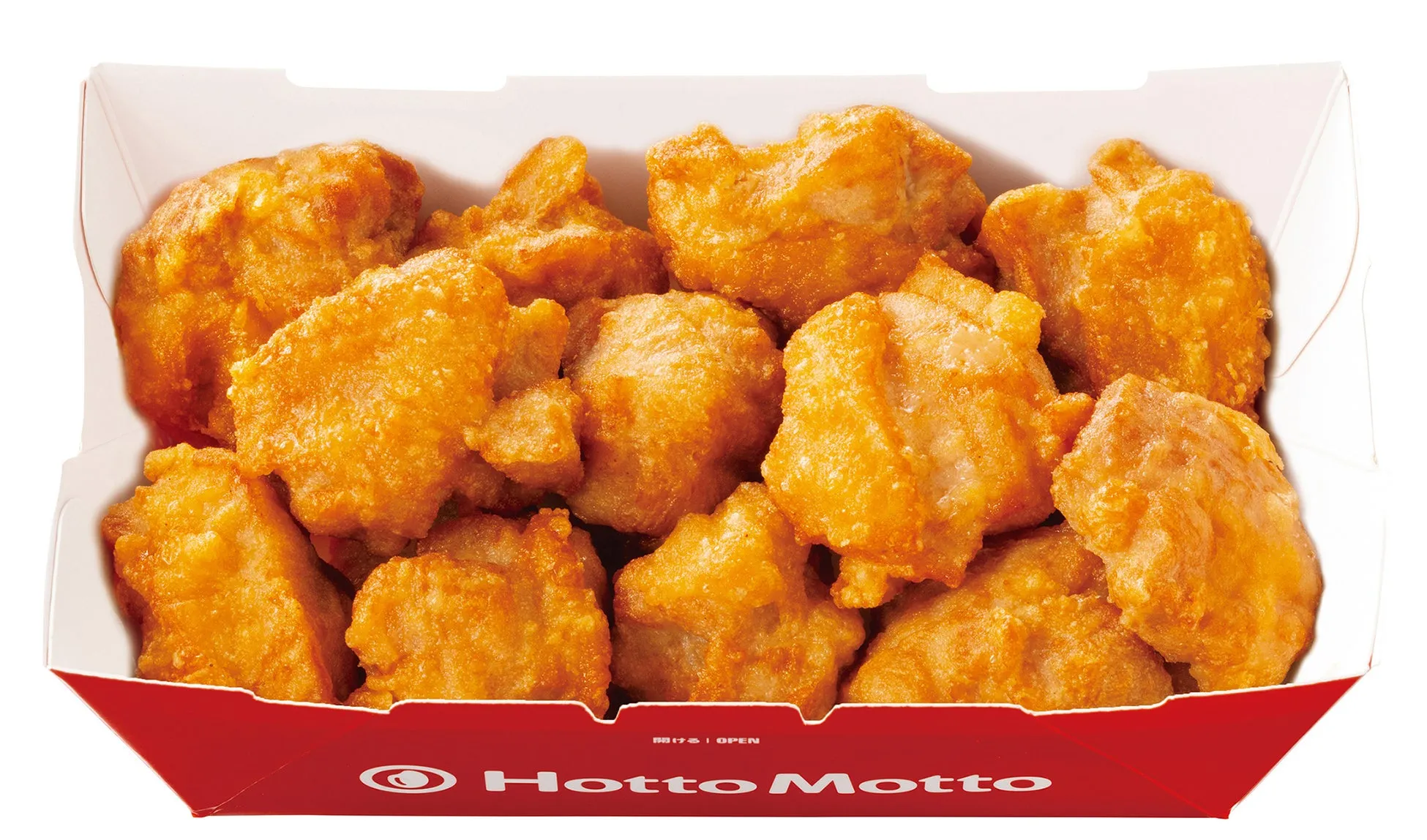 揚げられたチキンナゲットが詰められた箱のクローズアップです。
