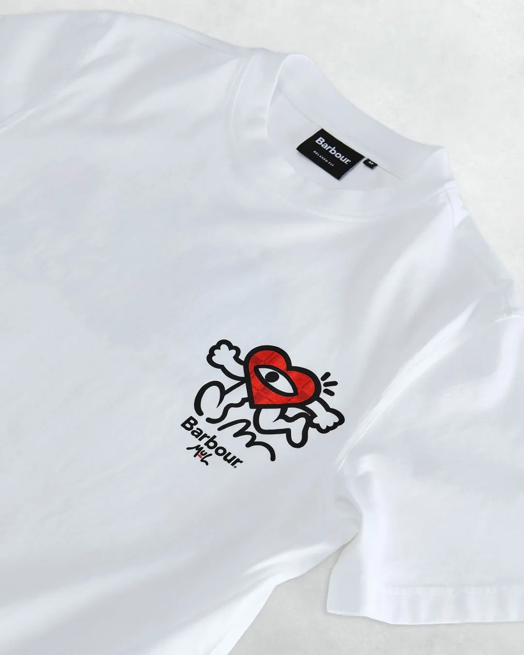 Running Heartがカヌーに乗る様子が描かれたTシャツ