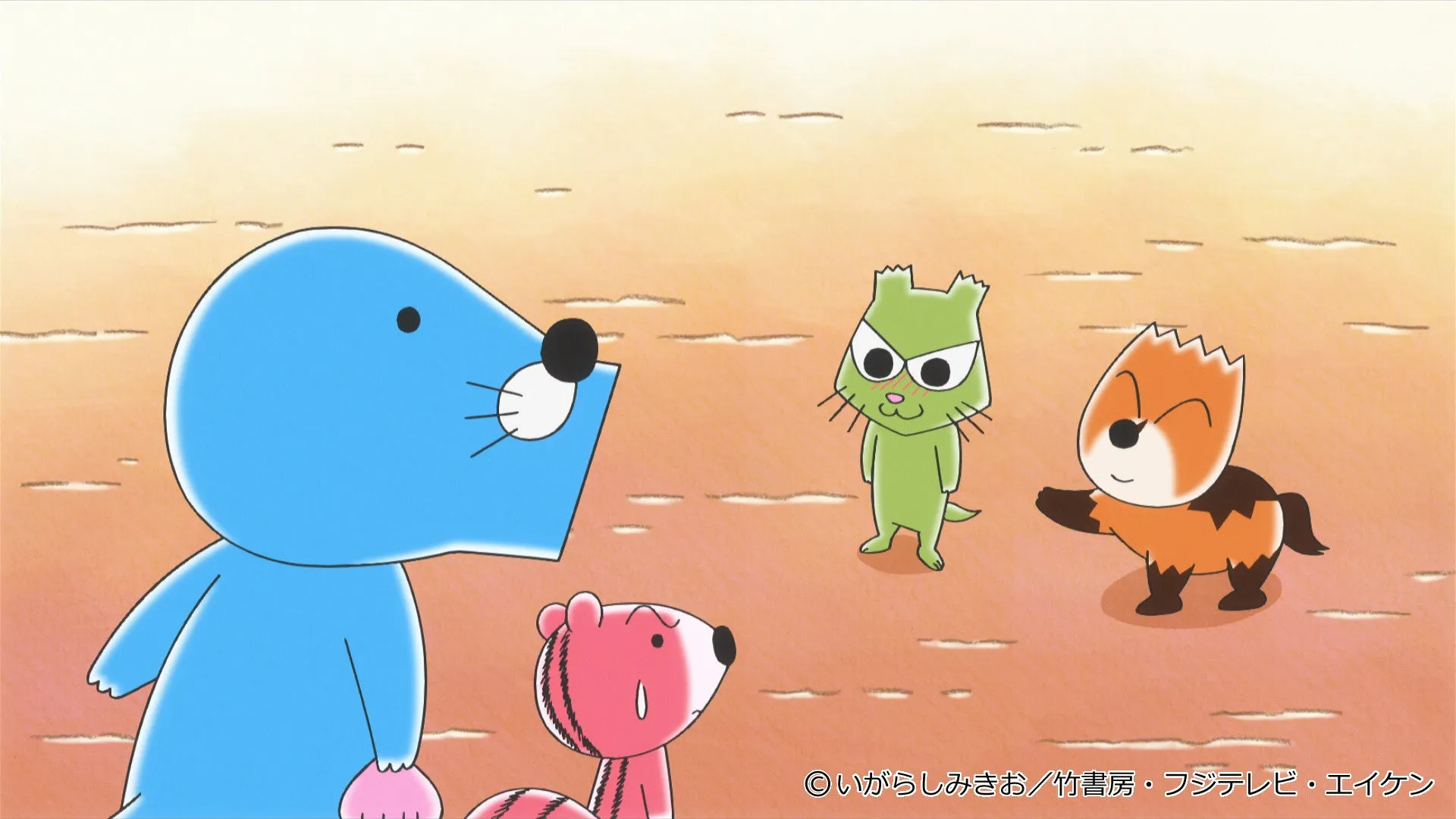 4匹のキャラクターが描かれたアニメのワンシーン。青いキャラクターが口を開き、緑色のキャラクターは困惑した表情、オレンジ色のキャラクターは手を広げ、ピンク色のキャラクターは不安げな様子をしている。