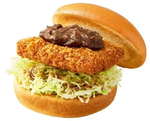 ハンバーガーのクローズアップ画像。揚げ物、キャベツ、ソースが挟まれています。