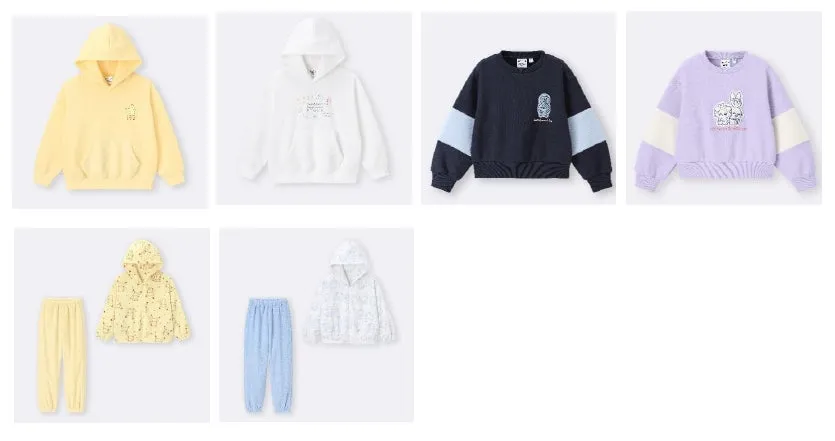 さまざまなデザインの子供服のセットが写っています。パーカー、トレーナー、パンツがあり、明るい色合いで、動物のイラストが施されています。
