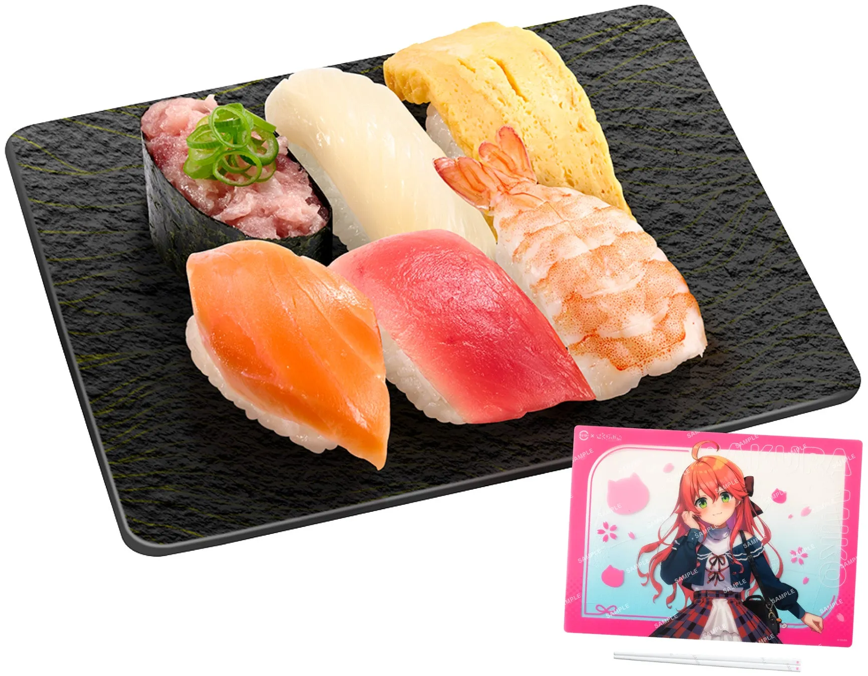 お寿司の盛り合わせと、アニメのキャラクターが描かれたピンク色のコースター、箸が写っている画像