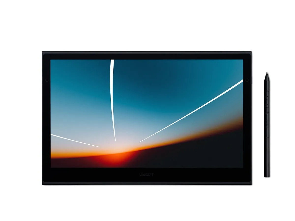 Wacomの液晶タブレットとペン。タブレットの画面には抽象的な風景が映し出されている。