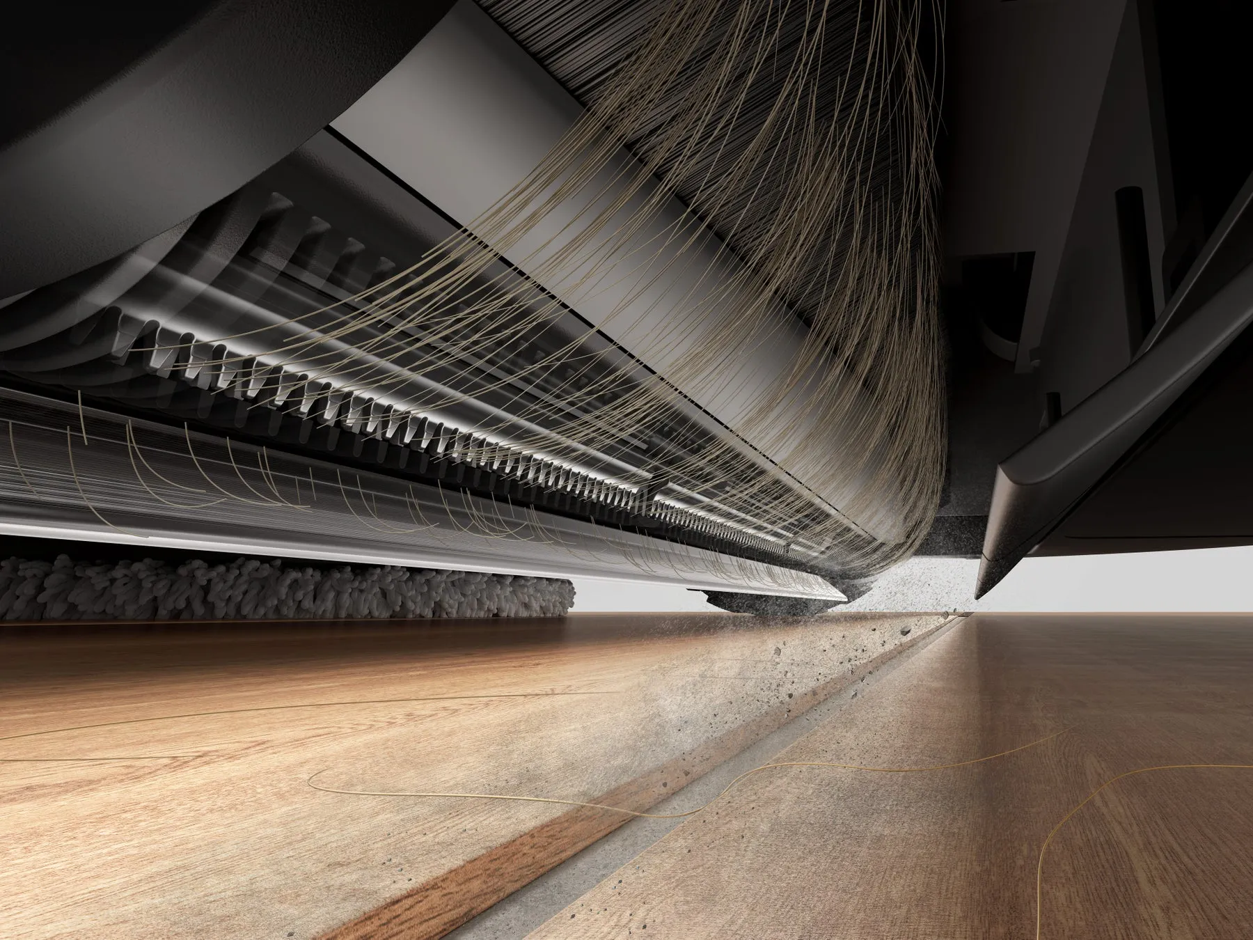 掃除機のブラシ部分のクローズアップ写真。ブラシが床のゴミをかき集めている様子。