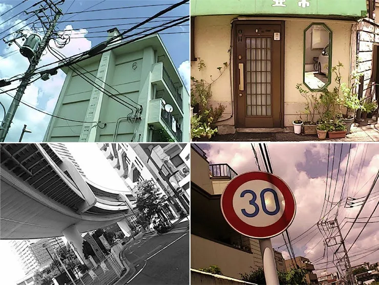 日本の街並みの風景を捉えた写真。電線、建物、標識、店舗などが写っています。