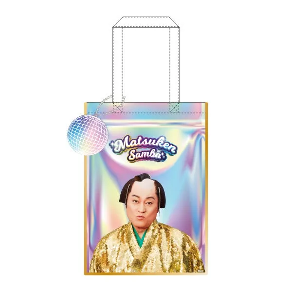 松平健の顔がプリントされたトートバッグ。キラキラしたゴールドの衣装と、背景のオーロラのようなデザインが特徴的。