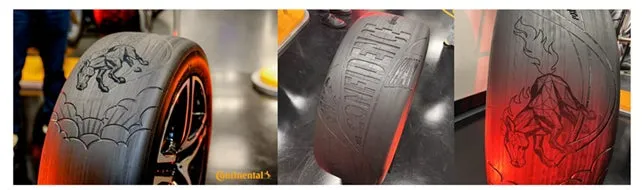 タイヤの側面に施されたデザイン。黒いタイヤの側面には、狼のシルエット、太陽のような模様、そして「CONFIDENCE」という文字が刻まれている。タイヤの側面は赤く光っている。