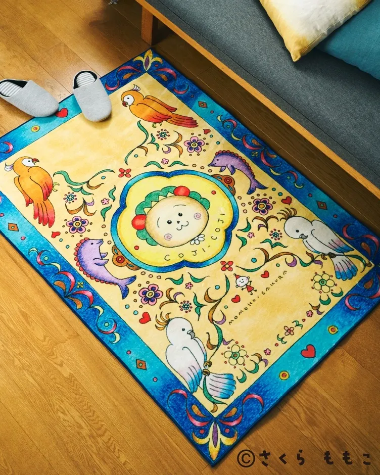 カラフルなイラストが描かれたラグ