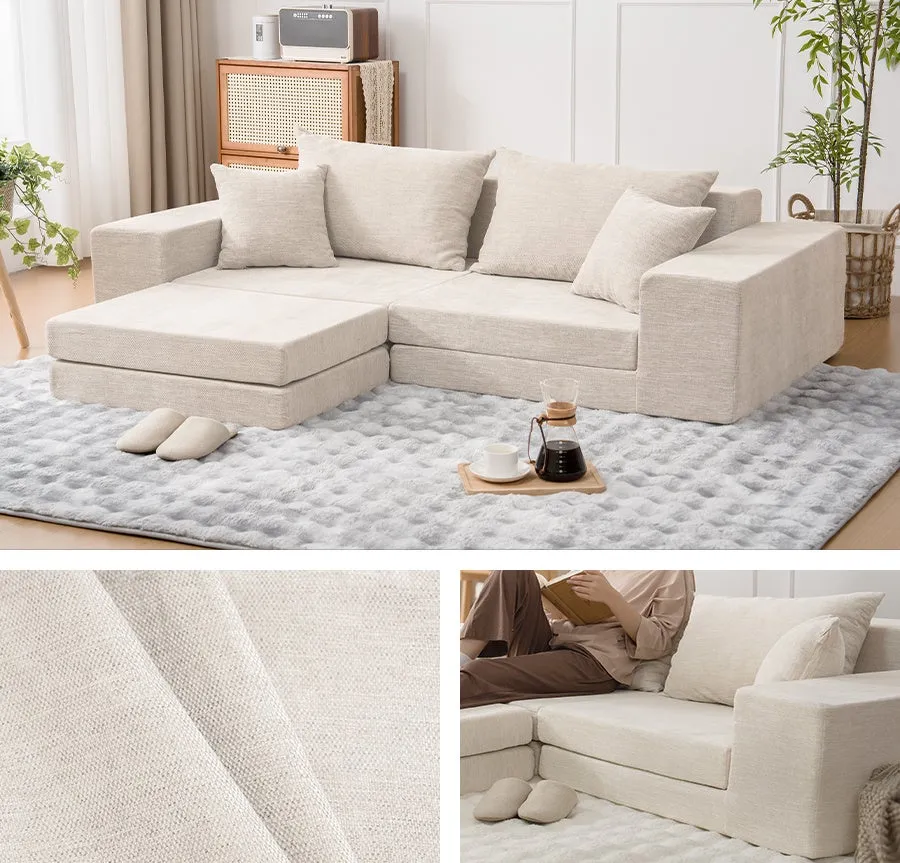 ベージュ色のL字型ソファが置かれたリビングルームの写真です。