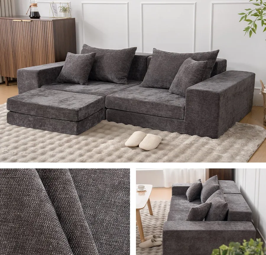 グレーのモダンなソファが置かれたリビングルームの写真です。