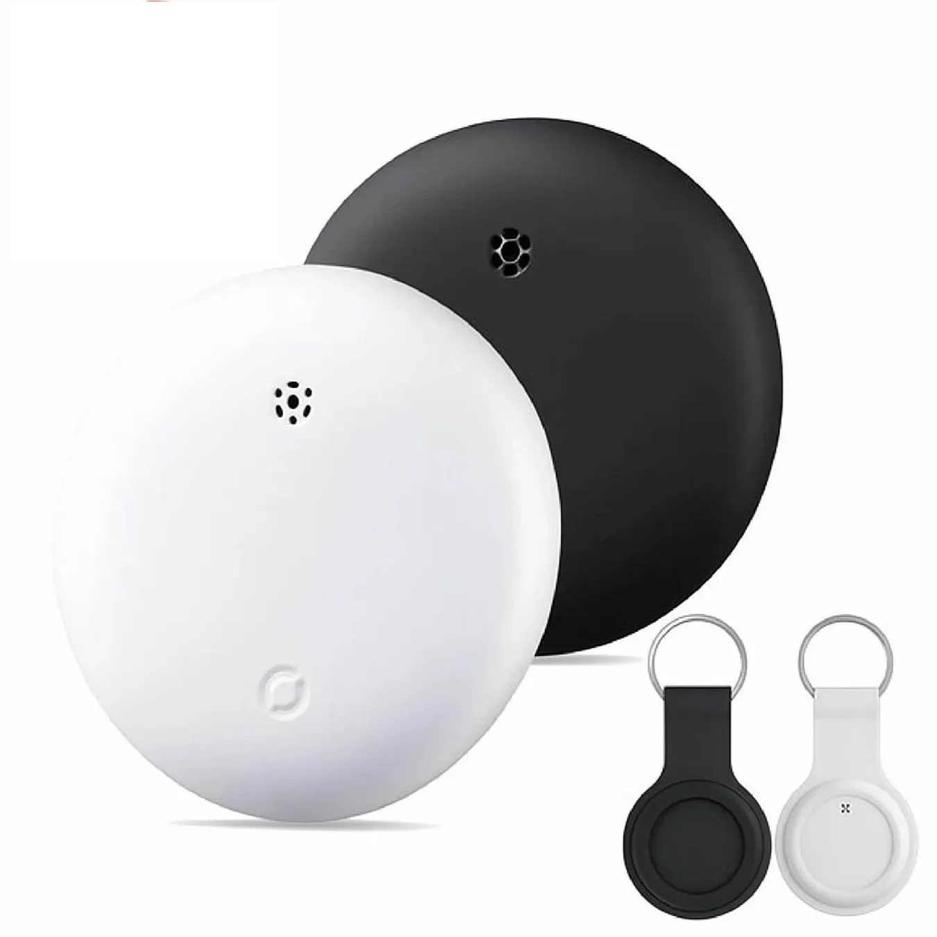 丸いデザインの白い物体と黒い物体が並んでおり、キーホルダーが2つ添えられている画像です。