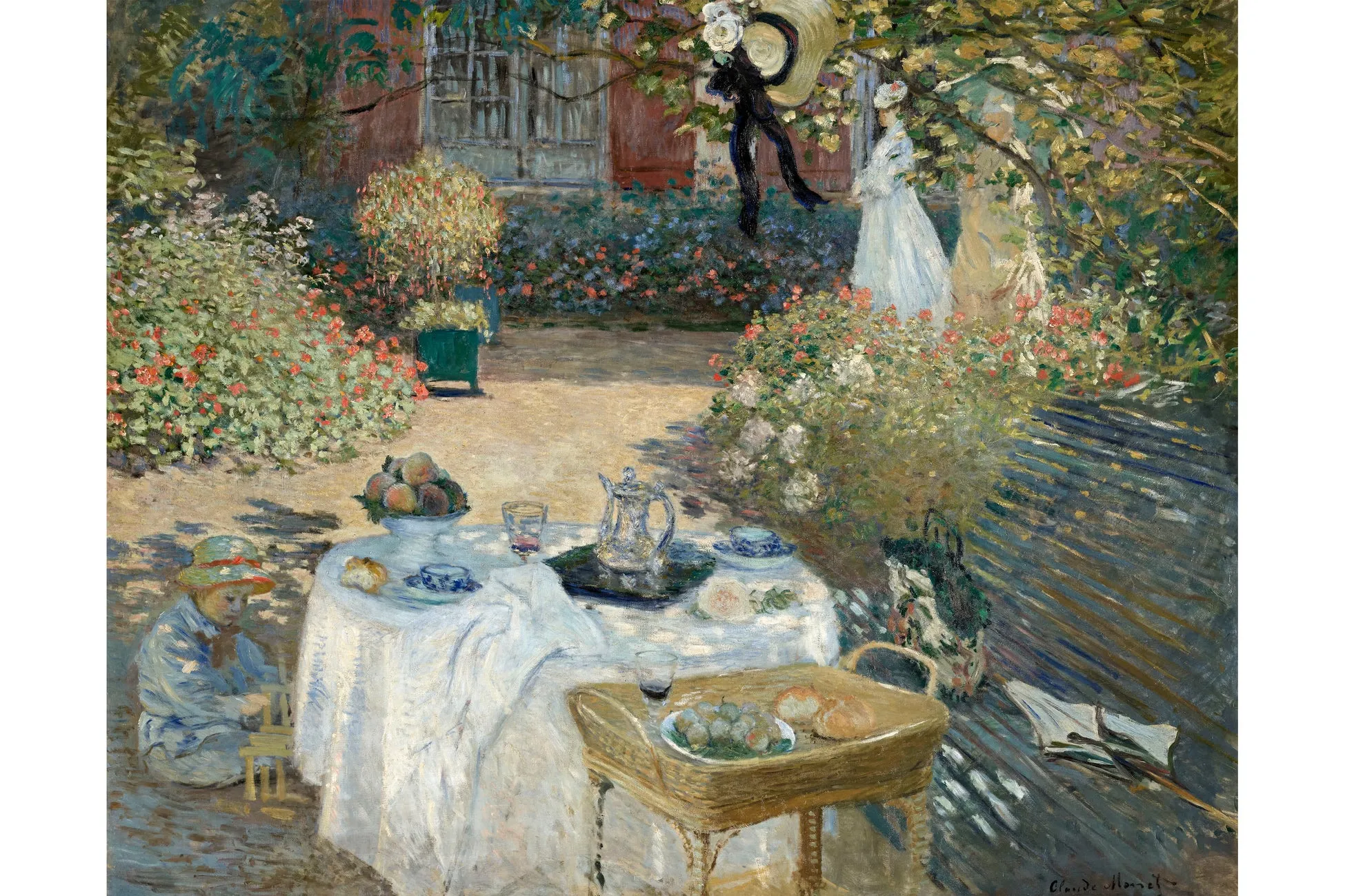 庭園で食事をする人々の絵画