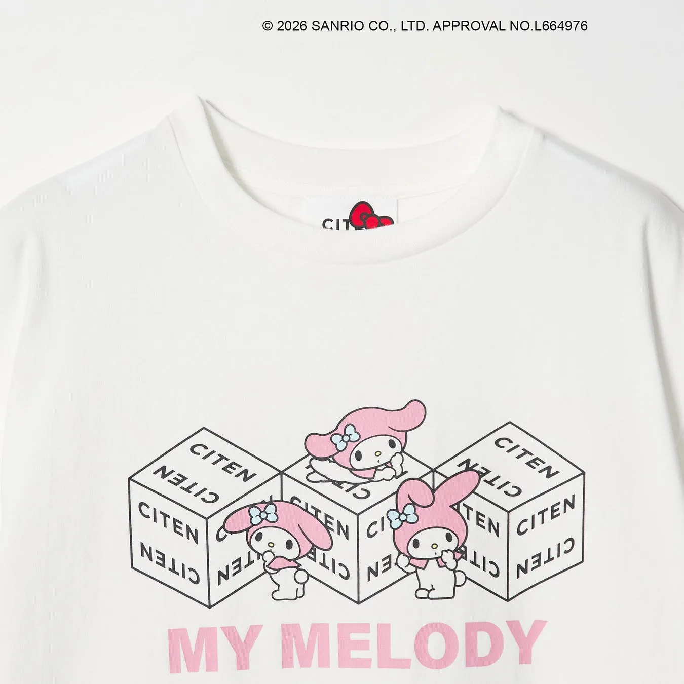 マイメロディのイラストが描かれた白いTシャツ。立方体の上にマイメロディが描かれており、周囲には「CITEN」の文字が配置されています。