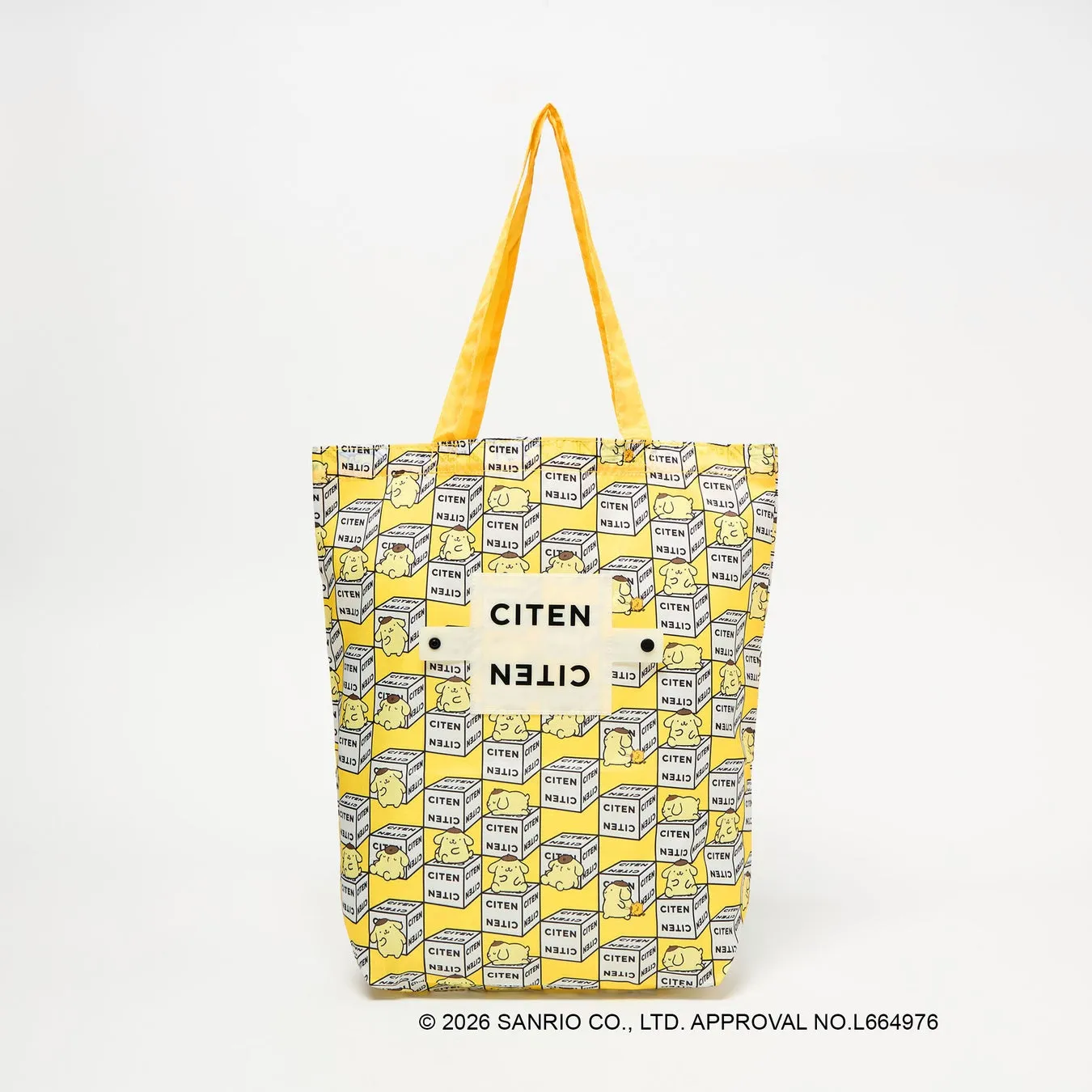 黄色を基調としたCITENのトートバッグ。バッグ全体にキャラクターとCITENのロゴがプリントされています。持ち手は黄色です。