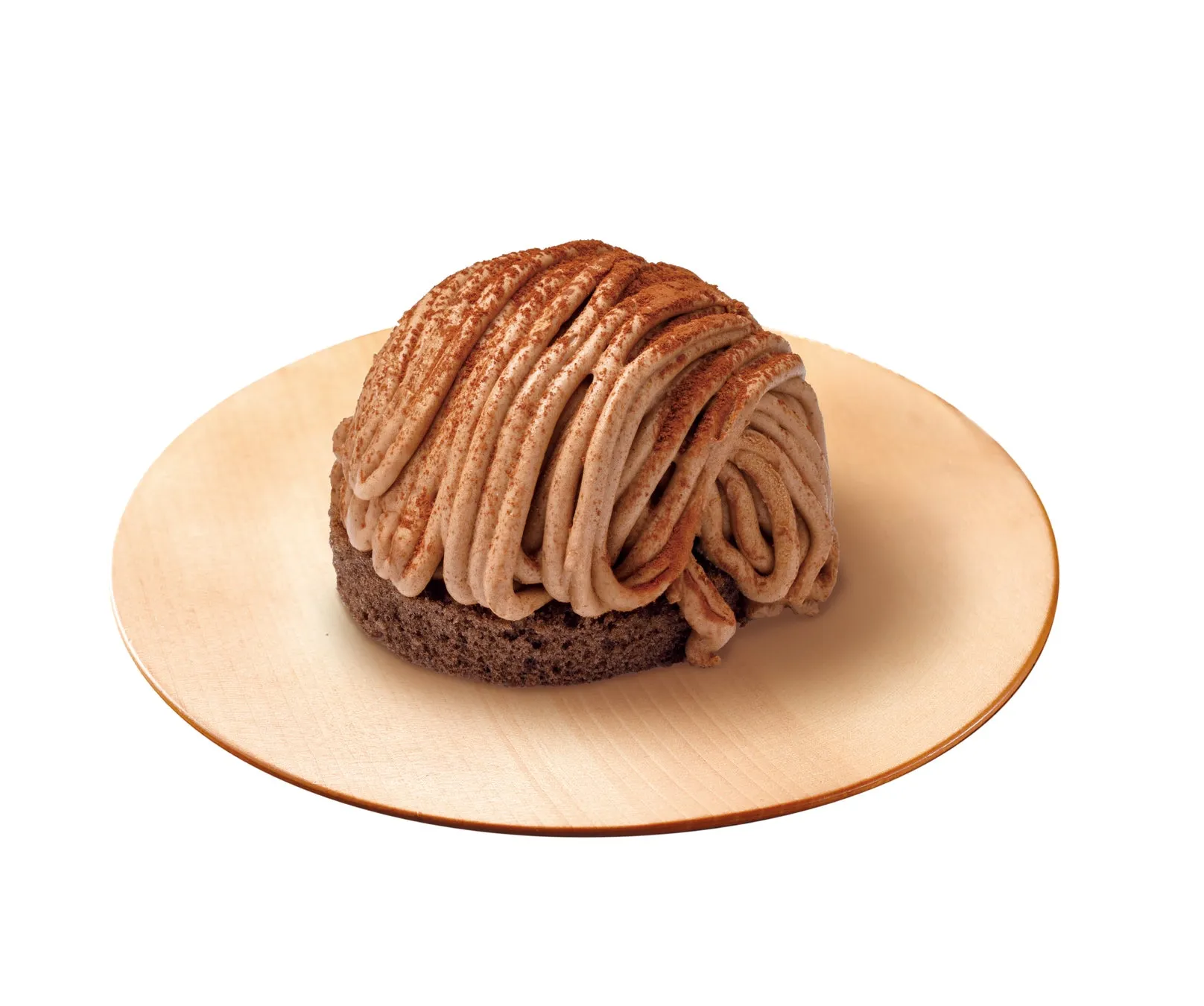 モンブランケーキが木製の皿に乗っている写真です。ケーキは、茶色のスポンジケーキの上に、クリーム色のモンブランクリームが螺旋状に絞られています。上にはココアパウダーが振りかけられています。