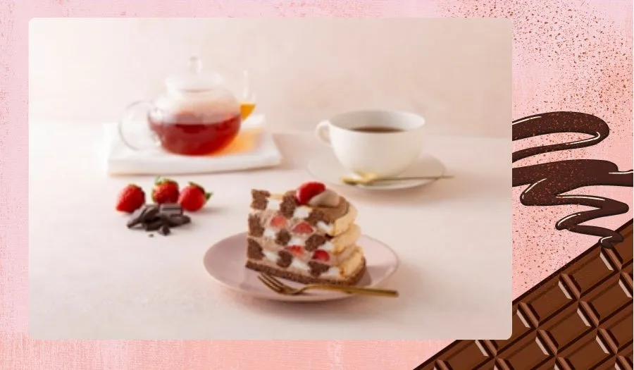 いちごのケーキと紅茶とチョコレートが写った画像です。