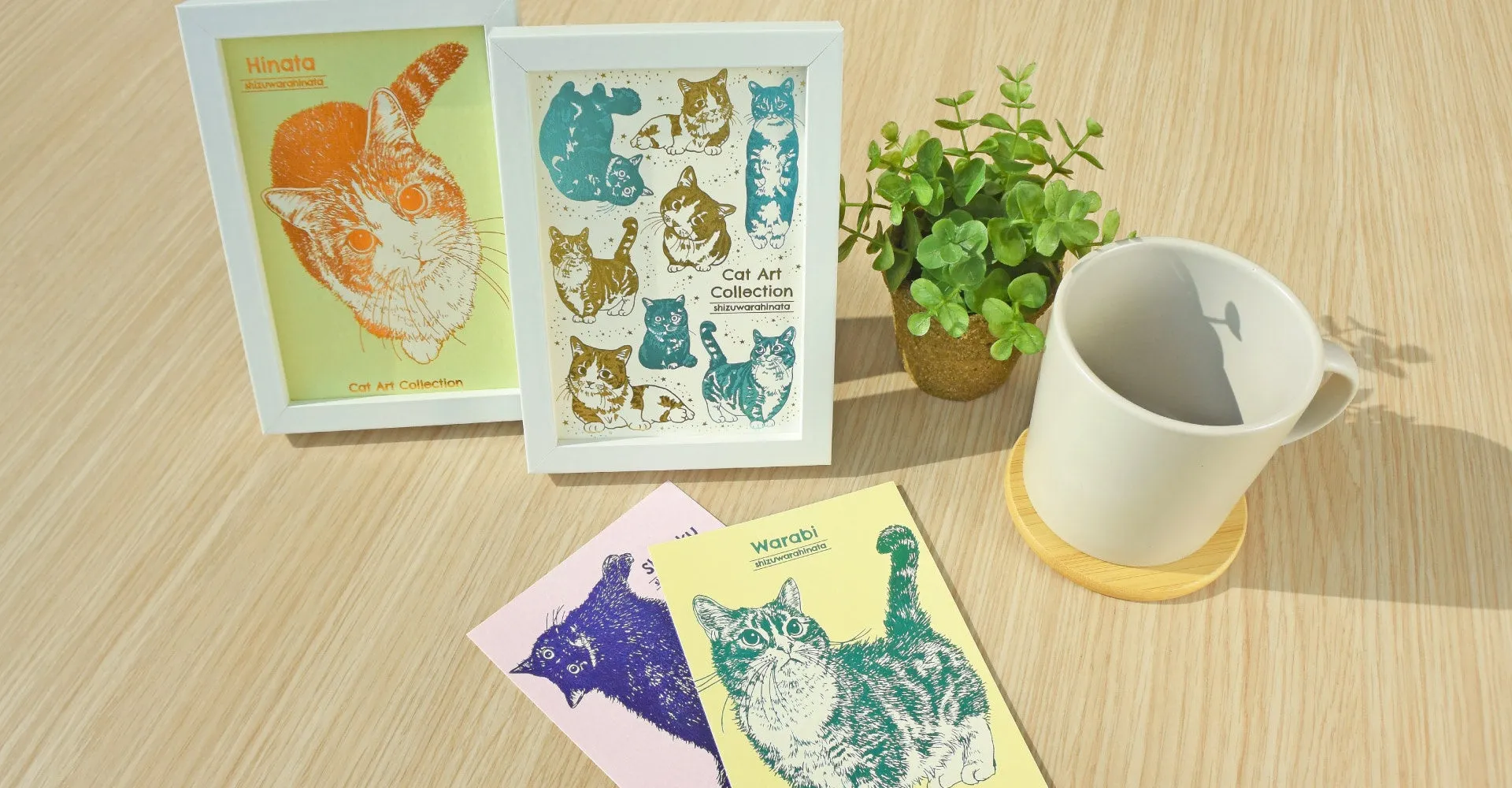 猫のイラストが描かれたフレームやカード