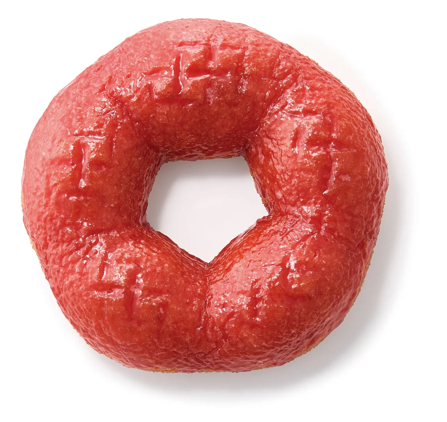 赤いグレーズをかけたドーナツのクローズアップ写真。