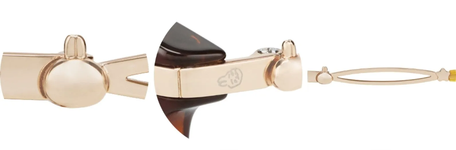 金色のヘアクリップのクローズアップ画像。ヘアクリップの前面と背面が写っており、ディテールがはっきりと見えます。