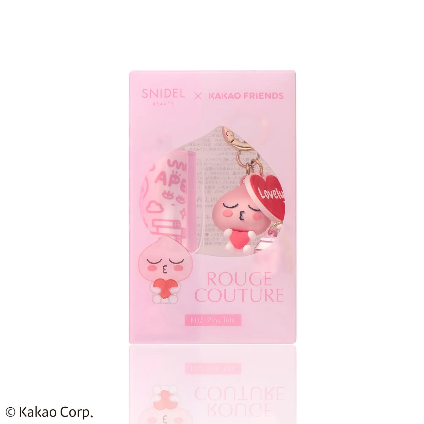 ピンク色のパッケージに入った、Kakao Friendsのキャラクター「APEACH」のキーホルダー。パッケージには「ROUGE COUTURE」と「K02 Pink Tutu」の文字が見える。