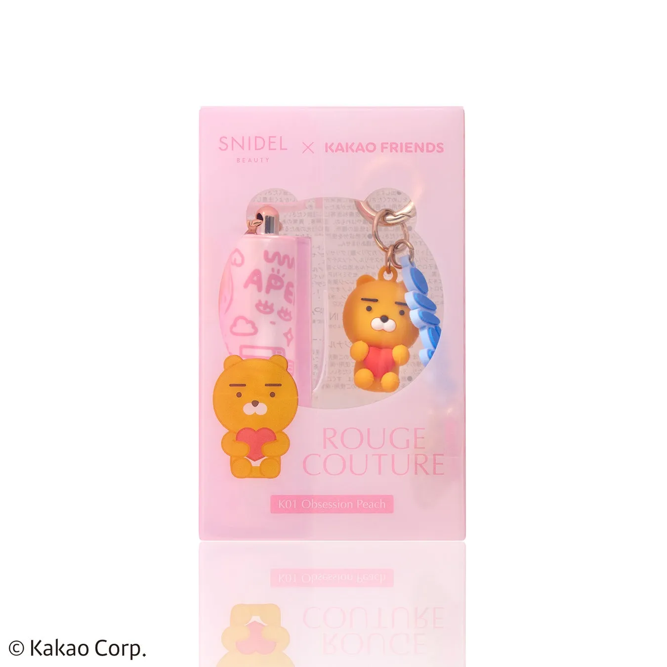 SNIDELとKAKAO FRIENDSのコラボ商品。リップとマスコットがついたキーホルダー。パッケージはピンク色で、リップにはAPEの文字とイラストが描かれている。マスコットはライアンで、ハートを持っている。K01 Obsession Peachと書かれている。