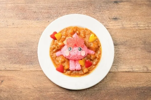 ピンク色のキャラクターが乗ったカレーライス