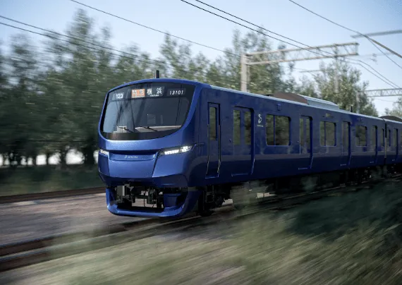 青色の電車が走っている様子