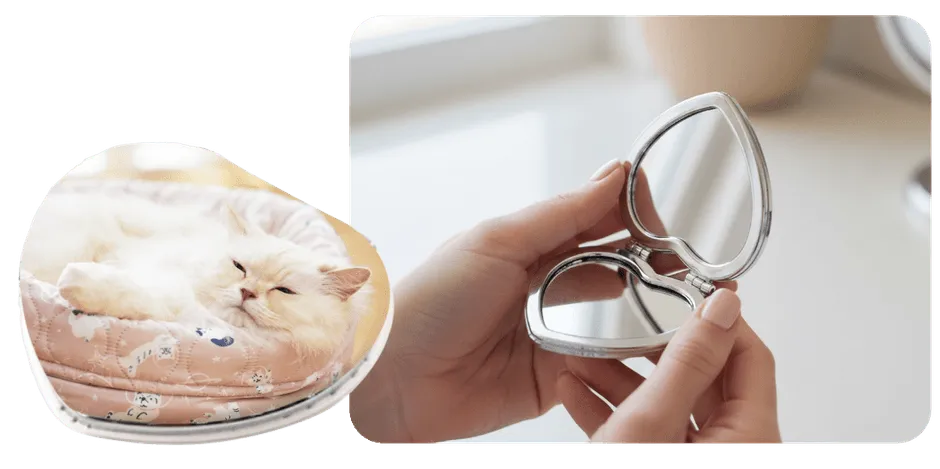 猫の顔がプリントされたハート型ミラー