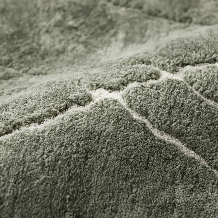 緑色のふわふわとしたカーペットのクローズアップ